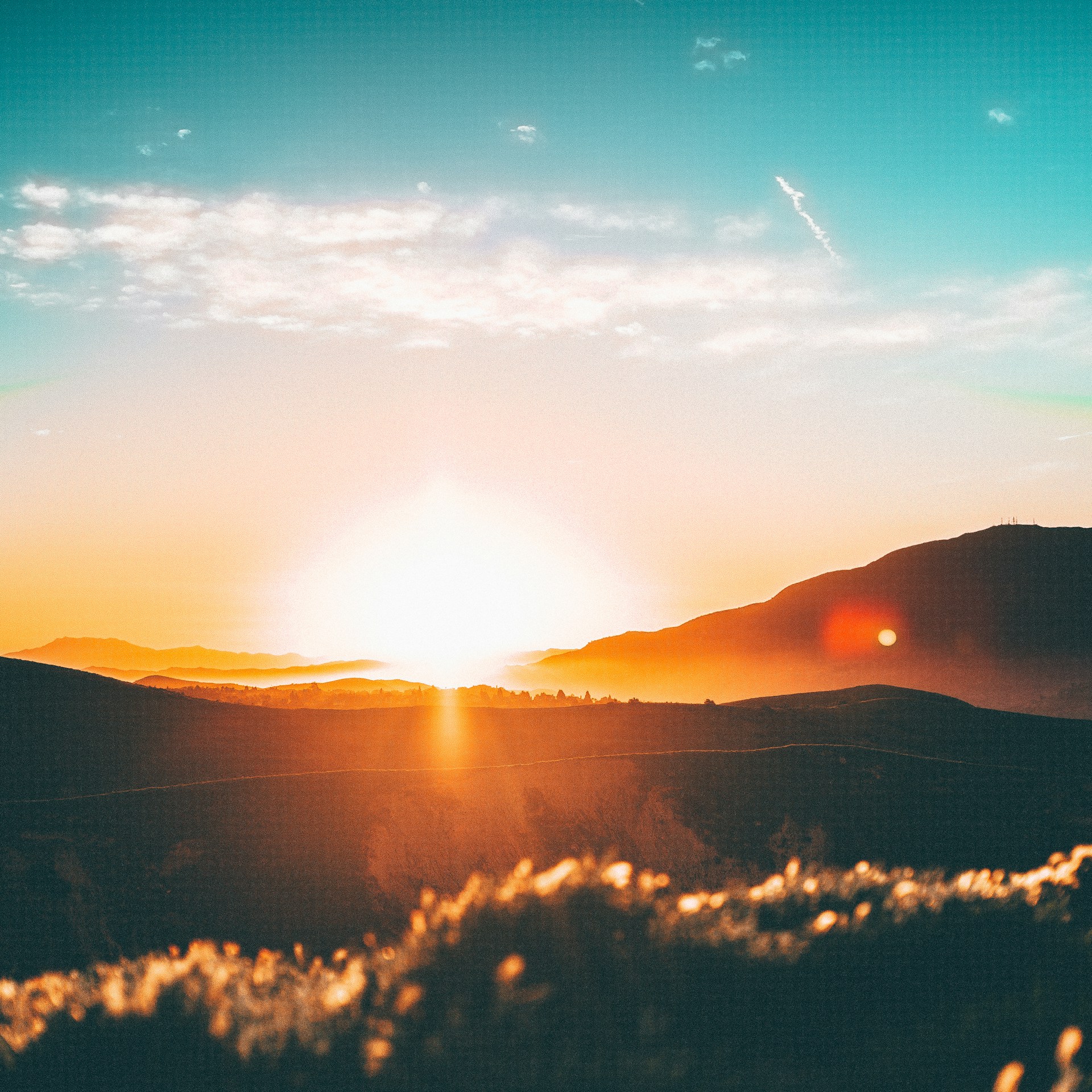 Sunlight breaking over a mountain landscape
