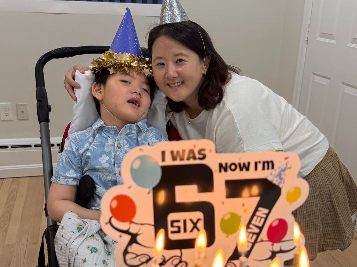 Sarah and Rowan celebrating together, from their official wheelchair van fundraiser.
